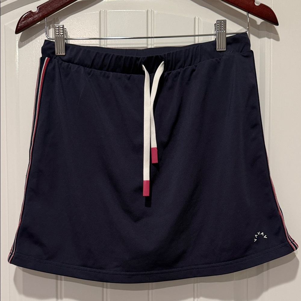 Varley Patrick Navy mid rise skort/skirt with red/white  Accents. Size M